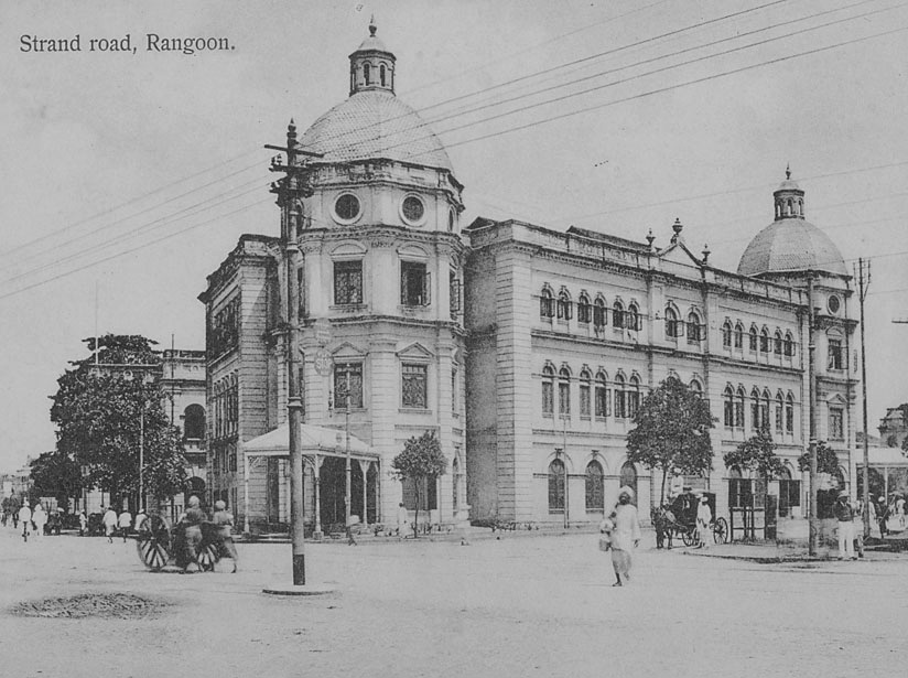 View of Strand Road Showing Civic Buildings and Group in Costume, Some in Uniform; Horse-Drawn Carriages and Cart. Collection of the National Anthropological Archives, Smithsonian Institution.