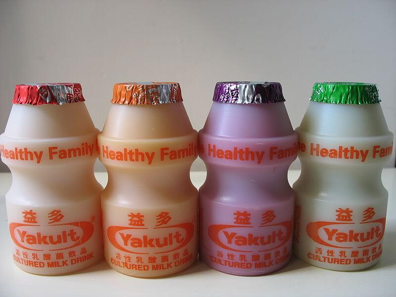 Yakult flavors in Singapore: regular, orange, grape and green apple. Photo credit:  Dezzawong, Wikimedia CC Wikimedia