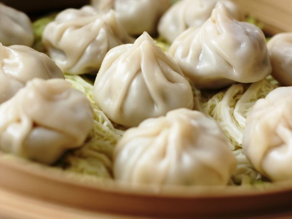 Momos can be shaped two ways--like pouches or like silver ingots (think potstickers).